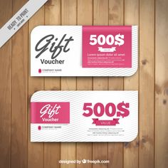 two gift voucher cards on wooden background