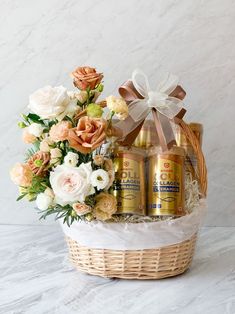 a basket filled with flowers and two cans of suntorye on top of it