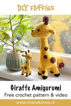 a crocheted giraffe amigurmi doll next to a plant