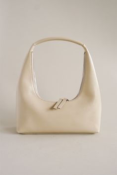 MARGESHERWOOD Hobo shoulder bag in glossy cream. Bag measurements: W 10.24 in. x H 12.99 in. (Including the strap) xD 3.15 in. Strap drop: 8.66 in. Weight : 0.51 ~ 0.6 lb. MW241-BG26-CRGP PIPE AND ROW Marge Sherwood, Cream Bag, Hobo Shoulder Bag, Bag Measurements, Black Bag, Womens Tote, Individual Style, Uganda, Cream Color