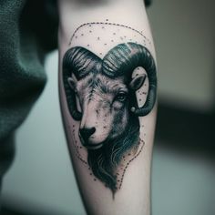 a ram tattoo on the left arm and calf's head is shown in black ink