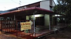 a small building with a sign on the front