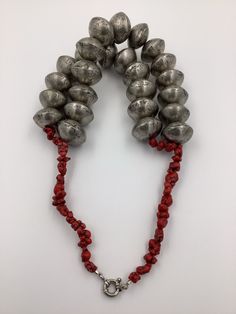 I made this lovely 2 strand neckpiece with handmade tuareg silver from Mali, West Africa and small red Turquoise Howlite beads. Authentic antique beads will commonly have small chips, corrosion and pitting due to their vintage. Each recycled / handmade bead is unique in shape, size and markings. Necklace Weight & Length: Weight 7 Ibs 2 oz Length 21 in Traditional Silver Hand-strung Turquoise Necklace, Traditional Hand-strung Turquoise Necklace, Traditional Silver Turquoise Necklace Hand-strung, Howlite Necklace, Red Turquoise, Turquoise Howlite, Handmade Beads, West Africa, Crochet Necklace