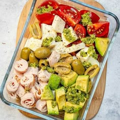 a glass dish filled with different types of vegetables