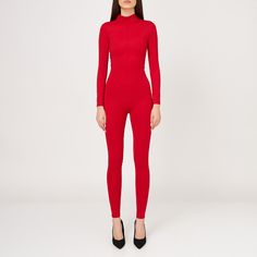 Elevate your style with this elegant long-sleeved fitted jumpsuit, perfect for any sophisticated occasion. Designed with sleek lines and a figure-hugging silhouette, this chic one-piece offers both comfort and a touch of class. Featuring a convenient back fastening zipper, it ensures a secure and flattering fit. Its form-fitting design accentuates your curves, while the long sleeves add a refined touch. Ideal for a night out or a special event, this timeless piece will turn heads on your night o Elegant Evening Bodysuit In Elastane, Fitted Full Length Bodysuit For Winter, Fitted Full-length Winter Bodysuit, Sleek Long Sleeve High Stretch Unitard, Red Long Sleeve Fitted Bodysuit, Red Fitted Long Sleeve Bodysuit, Elegant Fitted Long Sleeve Jumpsuits And Rompers, Elegant Long Sleeve Bodysuit For Winter, Elegant Second-skin Bodysuit For Workwear