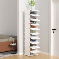 a white shoe rack in the corner of a room