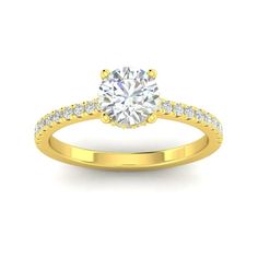 a yellow gold engagement ring with diamonds on the band and a round cut diamond in the center