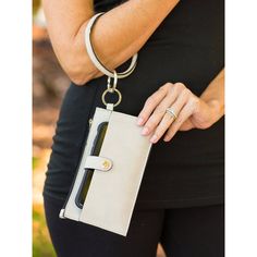 Our Bangle Wristlet In Gray Is Perfect To Take With You On A Quick Trip To The Store Or A Night Out! The Front Magnetic Snap Pocket Is Perfect For Your Phone. The Zipper Pocket Keeps Lipstick, Credit Cards, And Cash Safe. The Carabiner Attaches To Or Can Act As Your Keychain Allowing You To Keep All The Essentials Close At Hand. It Measures 4" X 7.5" Zipper Pouch With Phone Snap Pocket And Detachable 4" Bangle Keyring With Carabiner. Versatile Wristlet With Wrist Strap, Cash Safe, Mini Hand Bag, Fringe Clutch, Bottega Veneta Clutch, Snakeskin Purse, Pink Wristlet, Michael Kors Wristlet, Vintage Clutch