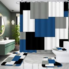 a bathroom with blue, gray and white decor on the shower curtain next to the toilet