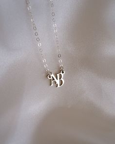 Capture your unique identity with this custom Monogram Initials Necklace for a look that is all your own! Pick two of your own initials to make it your own and harness the power of personalization with this modern, dainty necklace! NECKLACE FEATURES Choice of material: 18k Gold or .925 Sterling Silver Cable chain is sterling silver or 14K gold filled. Pick two initials, all custom made to order. Necklace comes with a 1" chain extender. Custom made to order, this item is final sale. Dainty Tarnish-resistant Initial Necklace For Personalized Gift, Gold-tone Chain Necklace With Initial Pendant For Gift, Gold-tone Initial Pendant Charm Necklace With Adjustable Chain, Elegant Letter-shaped Initial Necklace, Elegant Letter-shaped Necklace For Personalized Gift, Freshwater Pearls Earrings, Chain Extenders, Moonstone Ring, Pretty Earrings