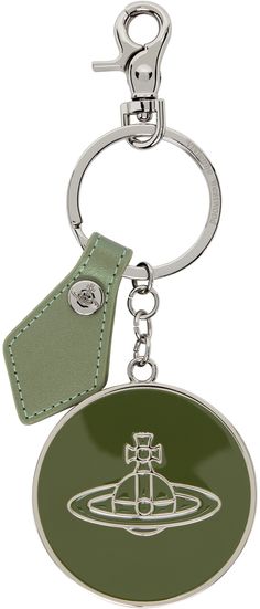 a metal key chain with a green leather tag attached to it's center ring