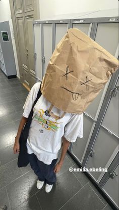 a person with a paper bag on their head