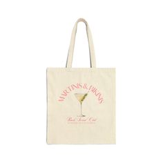 a tote bag with the words martinis and mary on it in pink lettering