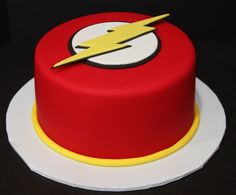 a red and yellow cake with a flash logo on top