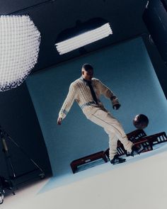 a man standing in front of a camera and lighting equipment