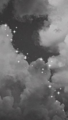 black and white photograph of stars in the clouds