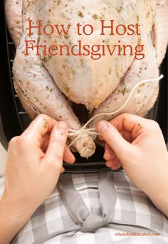 two hands holding a whole chicken in front of the words how to host a thanksgiving dinner