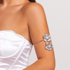 Title: Geometric Floral Upper Arm Cuff with CZ Inlay â€?18k Gold Silver ToneDescription:Add a touch of grace and trendiness to your look with our Geometric Floral Upper Arm Cuff. Crafted from high-quality alloy metal and studded with cubic zirconia. this stunning piece is a perfect gift for her to cherish and flaunt.Featuring an intricate geometric design in 18k gold silver tone. our arm cuff is a versatile accessory that can elevate any outfit. Whether you choose to wear it on its own or layer it with other jewelry. it's sure to make a statement.At just 0.26 oz. our arm cuff is lightweight and comfortable. making it perfect for all occasions. Whether you're headed to a casual outing or a special event. our cuff will complete your look with elegance and style.Specifications:Size: 3.7" * 3. Spring Wedding Rose Gold Jewelry, Elegant Adjustable Jewelry For Spring, Elegant Spring Anniversary Jewelry, Elegant Open Cuff Metal Bracelet, Elegant Spring Wedding Jewelry, Elegant Silver Bracelets For Spring, Elegant Silver Bracelet For Spring, Spring Wedding Bangle Bracelets, Elegant Cuff Jewelry For Weddings