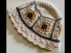 a crocheted hat with sunflowers on it