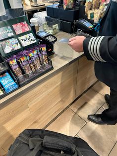 a man standing in front of a cash register