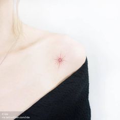 a woman with a small star tattoo on her shoulder