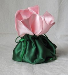 "This beautiful rose jewelry bag is is about 2 1/2\" square and 2\" high.   The drawstring bag is lined with anti-tarnish fabric which protects jewelry from tarnishing.  I have a variety of combinations of rose bags.  Red satin, white organza and yellow satin flowers.  The bag color may vary with different colors of green satin or velvet bags.  Please convo for details   The perfect wrapping for special little gifts or storing your favorite jewelry.  Unique bag is the perfect gift for bridal parties and themed parties.    Daisy, Sunflower and Poinsettia presentation bags are also available.  Important:  Do not wash the bag the anti-tarnish finish will come off." Pink Gift Bag Pouch, Handmade Pink Pouch For Gifts, Pink Gift Pouch, Velvet Bags, Handbag Sewing Patterns, Rose Bag, Bridal Bag, Silk Bag, Yellow Satin