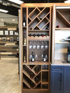 a wine rack filled with lots of bottles and glasses