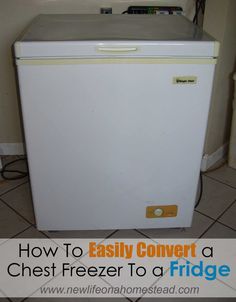 a white refrigerator freezer sitting on top of a tiled floor