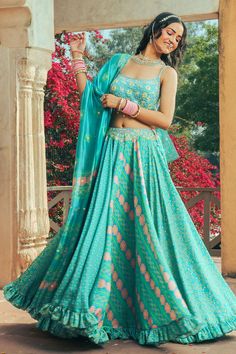 Aqua flared lehenga in satin base with contrast tiny floral prints. Comes with satin heavy hand embroidered blouse and a printed, embellished organza dupatta.
Components: 3
Pattern: Hand Embroidered, Embellished, Printed
Type Of Work: Floral
Neckline: Scoop
Sleeve Type: Sleeveless
Fabric: Lehenga and Blouse: Satin, Dupatta: Organza, Lining: Crepe
Color: Blue
Other Details: 
Embellished waistband
Frill hem lehenga
Tassel hem blouse and dupatta
Back multi tassel tie-up
Note: Potli bag shown in the Blue Floral Lehenga, Satin Dupatta, Flared Lehenga, Lehenga And Blouse, Blouse Satin, Hand Embroidered Blouse, Floral Lehenga, Potli Bag, Satin Hands