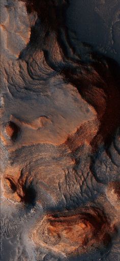 an aerial view of the earth's surface with rocks and dirt on it, as seen from space