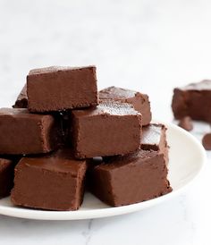 a white plate topped with brownies on top of a table