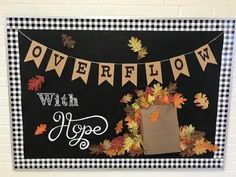 a black and white sign with leaves on it that says, overflow with hope