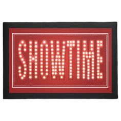 a red sign that says,'show the light up word'in bright lights