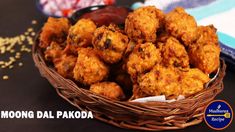 a basket filled with fried food sitting on top of a table