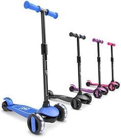 three scooters are lined up next to each other on the floor and one is blue