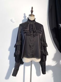 This price includes a shirt only, others are not included.   	 		 			Size 			S 			M 			L 		 		 			Bust 			115 			122.5 			130 		 		 			Shoulders 			39 			40 			41 		 		 			Full Length 			56 			60 			64 		 		 			Sleeve Length 			79 			80 			81 Collared Ruffle Tops For Fall, Fall Collared Top With Ruffles, Fall Ruffled Collared Tops, Black Ruffled Collar Top, Black Long Sleeve Ruffled Shirt, Black Ruffled Long Sleeve Shirt, Black Casual Shirt With Ruffles, Casual Black Shirt With Ruffles, Fitted Collared Tops With Ruffles