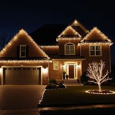 a house is lit up with christmas lights