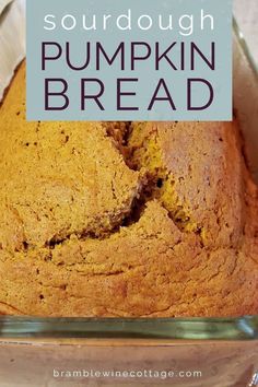 a loaf of pumpkin bread in a glass pan with the words sourdough pumpkin bread