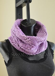 a black mannequin with a purple scarf on it