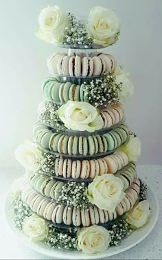 there is a large cake made out of macaroons and roses