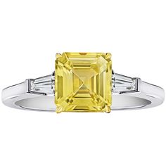 2.52 carat emerald cut yellow sapphire with tapered emerald cut diamonds .27 carats set in a platinum with 18k yellow gold ring. This ring is currently a size 7. We will resize to your finger size without charge. Sapphire Engagement Ring Emerald Cut, Astrology Ring, Yellow Sapphire Ring Engagement, Emerald Cut Sapphire Ring, Flat Ring, Yellow Sapphire Rings, Platinum Diamond Rings, Inspirational Messages, Emerald Engagement Ring Cut