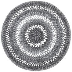 a circular rug made out of black and white crocheted yarn on a white background