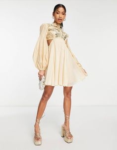 ASOS DESIGN embellished balloon sleeve mini dress with diamante cage cut out detail in beige | ASOS Cream Puff Sleeve Mini Dress For Party, Chic Embellished Cream Dress, Chic Cream Embellished Dress, Long Sleeve Embellished Beige Dresses, Beige Long Sleeve Embellished Dress, Spring Embellished Beige Mini Dress, Cream Embellished Long Sleeve Dress, Mini Dress With Sleeves, Girly Girl