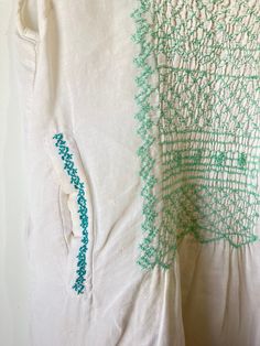 Local Brand White w Green Embroidery Dress. Perfect sleeveless mini dress with delicate green embroidery and back keyhole and button closure. Front pockets with bright teal detail! Flirty and sheer, perfect for a summer day on the town or strolling the pier. Feels like linen. hand wash cold. Marked as XS. Has a faint area of discoloration on the left breast area. Sold as is. Approx. Measurements Underarm to Underarm: 13" Length: 36" Casual Green Embroidered Dress With Embroidered Hem, Casual Green Embroidered Hem Dress, Casual Green Dress With Embroidered Hem, Green Embroidered Hem Dress For Summer, Green Embroidered Dress With Embroidered Hem For Summer, Green Embroidered Dress With Hem Detail For Summer, Green Casual Embroidered Summer Dress, Casual Green Embroidered Summer Dress, Green Sleeveless Embroidered Summer Dress