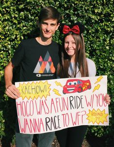 two people standing next to each other holding a sign that says taco was a fun ride w / o wanna race to wf?