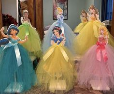 there are three dresses made to look like disney princesses