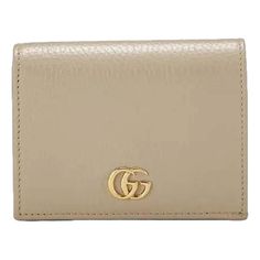 The Gucci Gg Beige Marmont Card Case Wallet Epitomizes Sophisticated Simplicity With Its Elegant Design And Practical Functionality. Crafted From Luxurious Beige Leather, This Card Case Features The Iconic Gg Monogram Embossed In A Subtle, Yet Striking Pattern, Which Adds A Touch Of Classic Gucci Flair To The Piece. The Wallet’s Sleek, Streamlined Silhouette Is Accented By The Signature Double G Logo In Gold-Tone Metal, Providing A Refined Touch Of Opulence. Inside, You'll Find Multiple Card Slo Double G Logo, G Logo, Gg Monogram, Card Case Wallet, Buy Gucci, Timeless Handbag, Pink Accents, Yellow Leather, Exclusive Bag