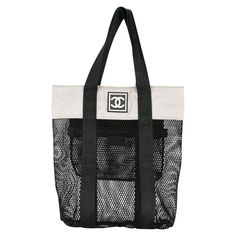 Chanel Mesh Logo Retro Sport Gym Shopper Tote Bag 2003 {VINTAGE 19 Years} Top handles Rubber printed logo at front Contrasting panels Top zip closure Internal zippered pocket 15" H x 12.2" W x 3.5" D Handle drop 8.3" Made in Italy Chanel Tote Bag, Logo Retro, Gym Tote, Chanel Brand, Vintage Tote Bag, Chanel Tote, Retro Sport, Retro Logos, Designer Tote Bags