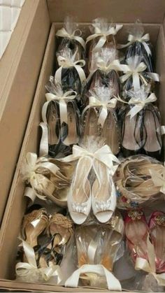 a box filled with lots of different types of shoes and bows on top of each other