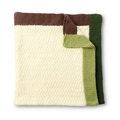 two knitted blankets with green and brown trims, one on top of the other